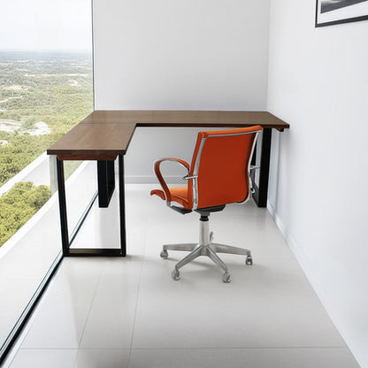 A solid hardwood L‑shaped work surface with sleek U‑shaped metal legs, arranged in a bright, modern corner office-1